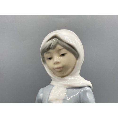 201 - Lladro 4812 ‘Girl with Goat’ in good condition - height 22.5cm