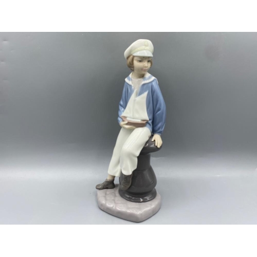 203 - Lladro 4810 ‘Boy with sailing boat’ in good condition - height 24cm