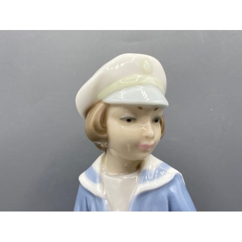 203 - Lladro 4810 ‘Boy with sailing boat’ in good condition - height 24cm