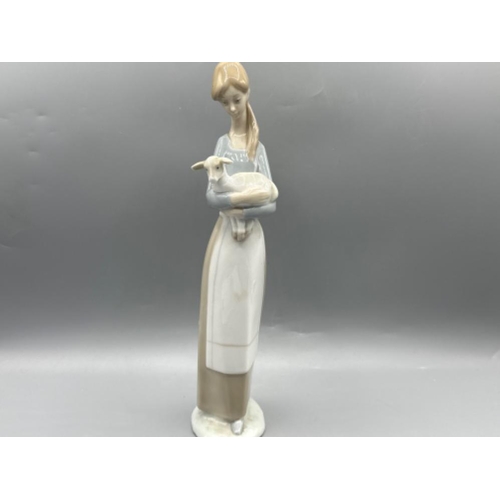 204 - Lladro 4505 ‘Girl with lamb’ in good condition, height 27cm