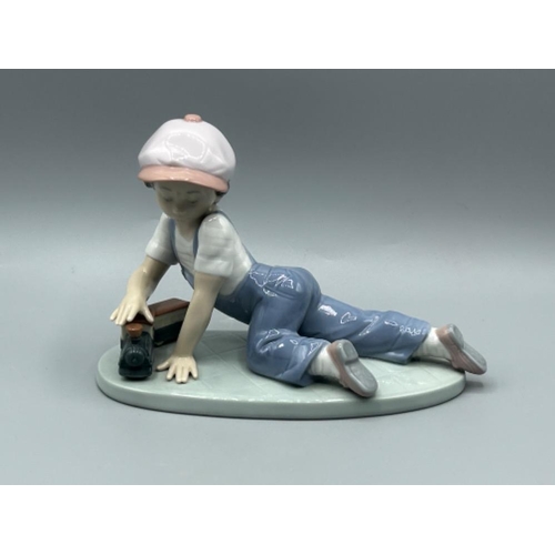 21 - Lladro 7619 ‘All aboard’ in good condition and original box