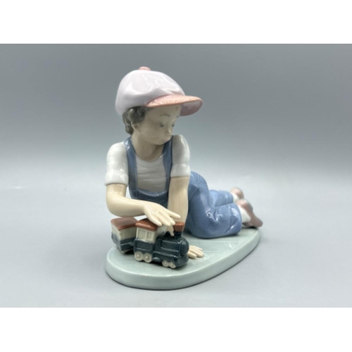 21 - Lladro 7619 ‘All aboard’ in good condition and original box