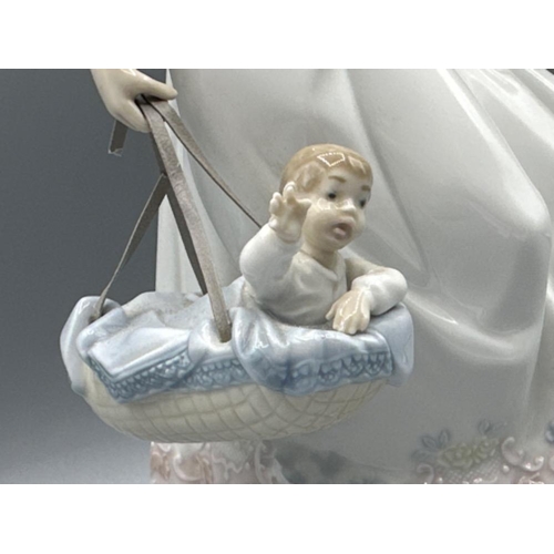 217 - Lladro 5874 ‘Off we go’, good condition (except part of basket has snapped) height 28cm