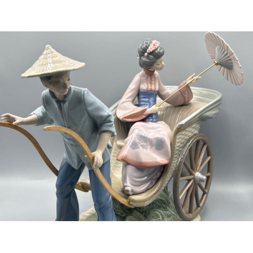 44 - Lladro 1383 ‘A Rickshaw ride’ in good condition with plinth and original box