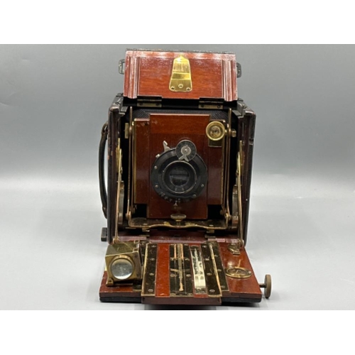 100 - Thornton Pickard folding Ruby mahogany & leather cased camera (1907)