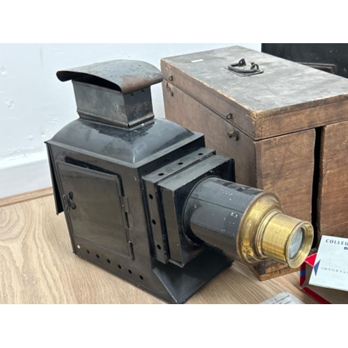 104 - Two Antique Magic Lantern slide projectors together with slides, lens etc