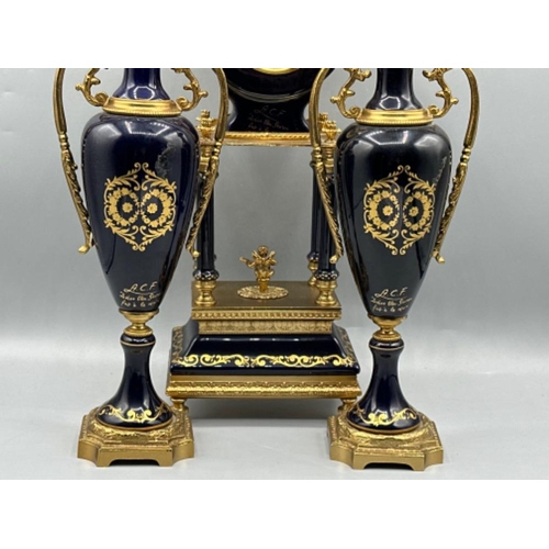 121 - A.C.F. Decor Bleu sevres “pait a la maim” porcelain clock with a pair of side-by-side matching twin ... 