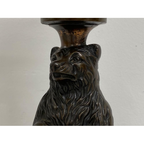 151 - Vintage oil lamp with cast metal bear and base, damage repair to globe split wick - height 45cm