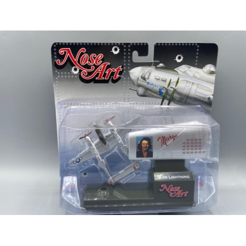 166 - 4 Corgi Nose Art model fighter planes ( see in image )