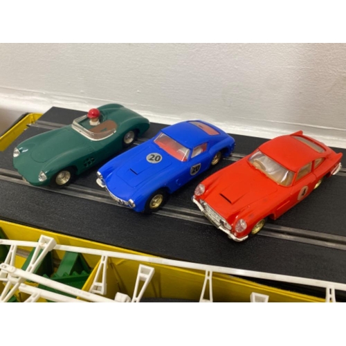 175 - Triang Scalextric model motor racing cars fitted with front and reer headlights in good condition