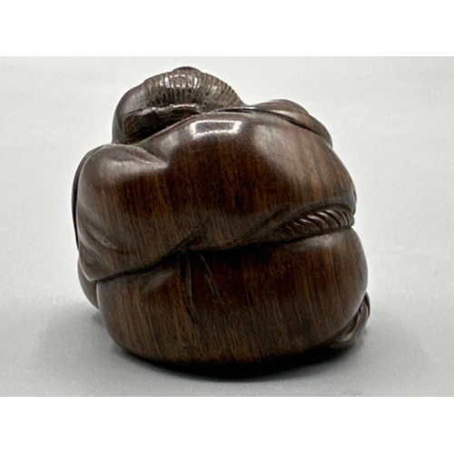 199 - Japanese hand carved Netsuke in the form of a sleeping monk, signed on base, H3cm x W4cm