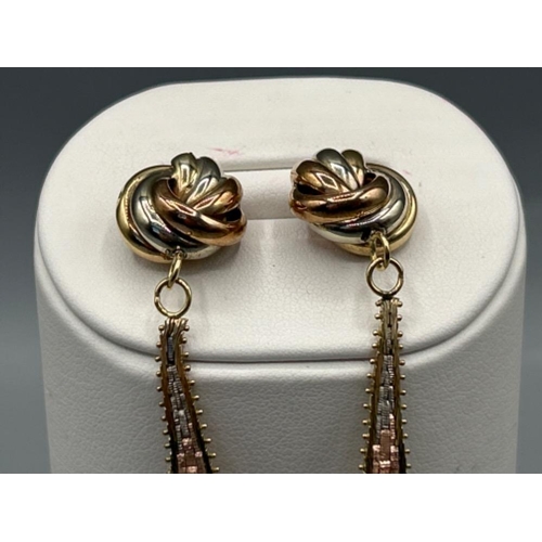 22 - Ladies 9ct 3 tone gold knot and drop Cleopatra earrings. 10.23g