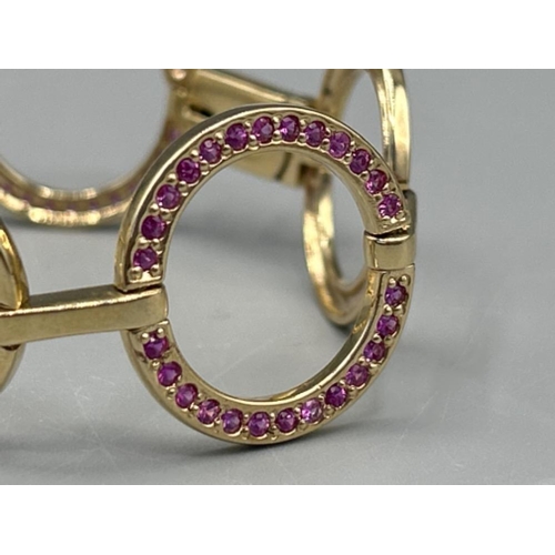 23 - Ladies 9ct gold Pink sapphire ornate bracelet 17cms and 22.95g