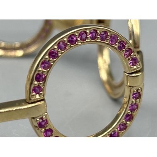 23 - Ladies 9ct gold Pink sapphire ornate bracelet 17cms and 22.95g