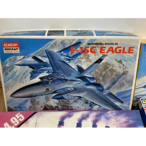 246 - 4x boxes of buildable vehicles to include The Titanic and F-15C Eagle