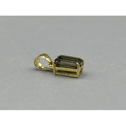 26 - 9ct gold green stone pendant