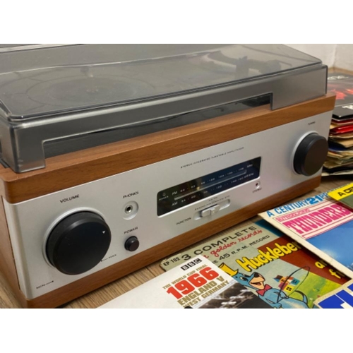 296 - A Turn table radio also with large amount of singles to include various police singles plus a blue l... 