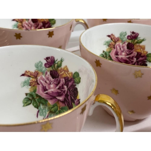 298 - 20 peice baby pink and 22kt accent tea set with floral design in good condition