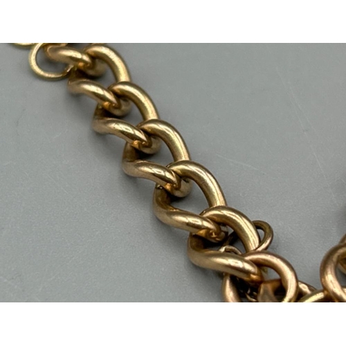 31 - Ladies 9ct gold curb link bracelet with heart padlock, 20cms and 12.81g