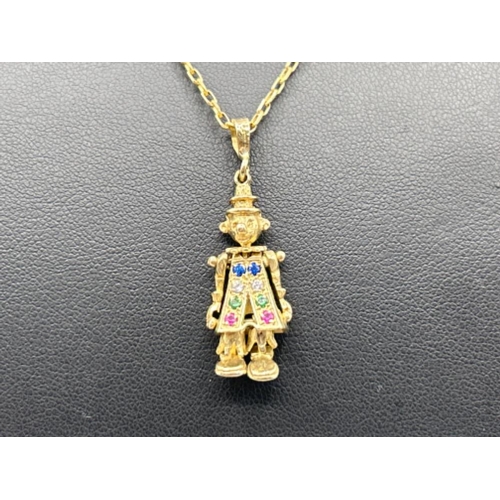 34 - Ladies 9ct gold Clown pendant with multiple gem stones on a 44cms belcher chain 4.17g