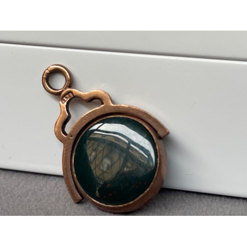 38 - 9ct Rose Gold Fob Charm/Pendant featuring a green stone - weighing 6.23 grams