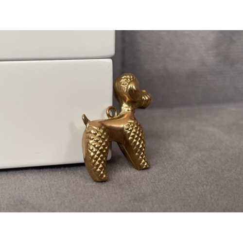 48 - 9ct Yellow Gold poodle charm - weighing 1.78 grams