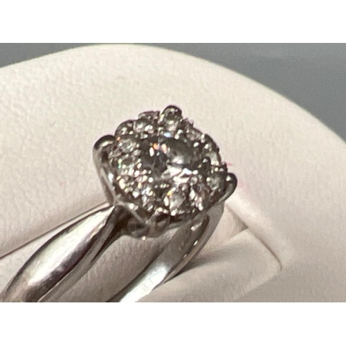 62 - Ladies 18ct white gold diamond cluster ring, size K