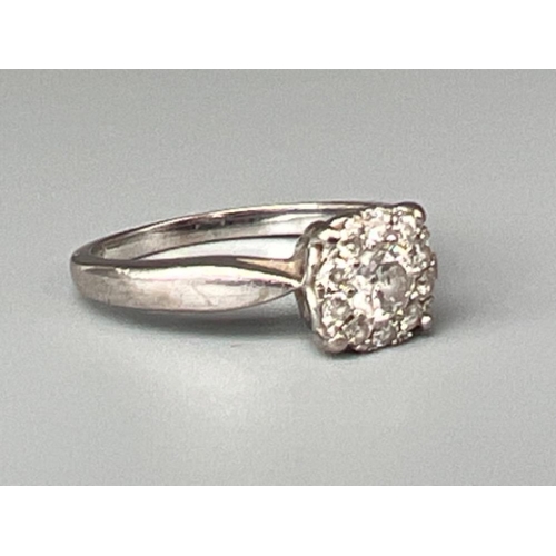 62 - Ladies 18ct white gold diamond cluster ring, size K