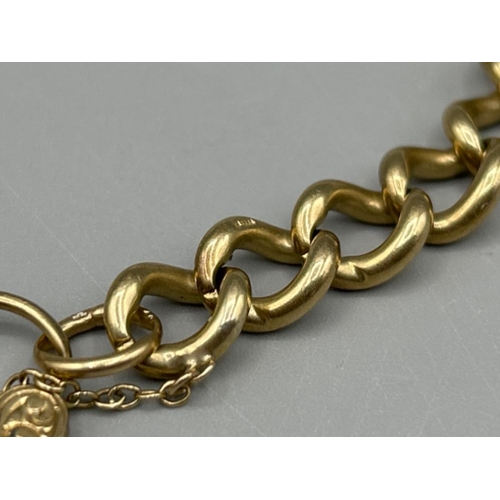 9 - Heavy 9ct gold curb chain bracelet with heart padlock, 23cms 26.89g