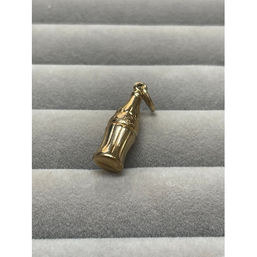 9 - 9ct Yellow Gold Coca Cola Bottle Charm weighing 1.34 grams