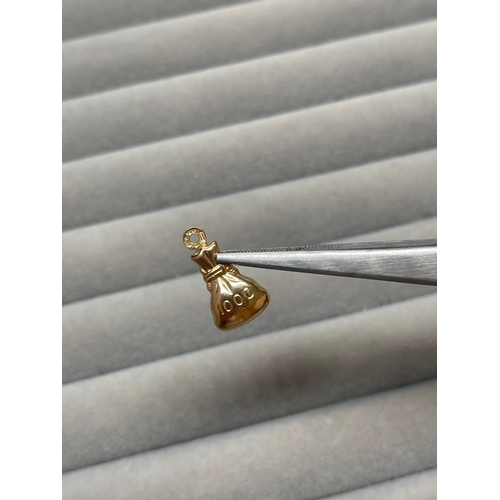 10 - 9ct Yellow Gold Fully Hallmarked 1000 Dollar Money Bag Charm Weighing 0.86 grams