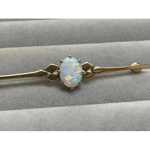 18 - 9ct Fully Hallmarked Fancy Design Brooch Featuring a 1.5ct Opal Weighing 3.17 grams Measuring 5cm in... 