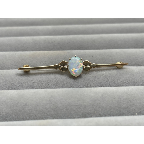 18 - 9ct Fully Hallmarked Fancy Design Brooch Featuring a 1.5ct Opal Weighing 3.17 grams Measuring 5cm in... 