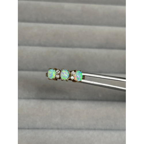 26 - 9ct Yellow Gold Fully Hallmarked Opal & CZ Ring Weighing 1.9 grams