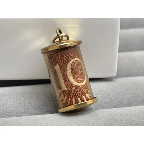 38 - 9ct Yellow Gold 10 Shilling Note Capsule Charm Weighing 2.56 grams