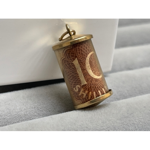 38 - 9ct Yellow Gold 10 Shilling Note Capsule Charm Weighing 2.56 grams