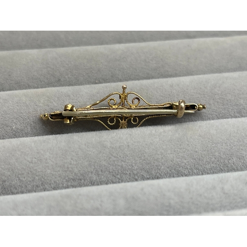 39 - 9ct Yellow Gold Fancy Design Brooch Featuring White and Red Stones Weighing 2.43 grams