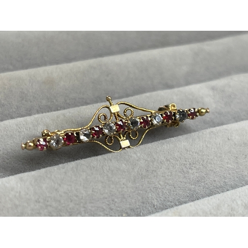 39 - 9ct Yellow Gold Fancy Design Brooch Featuring White and Red Stones Weighing 2.43 grams