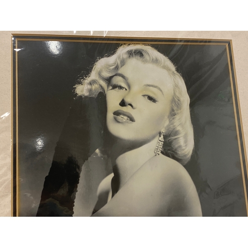 154 - Marilyn Monroe piece of black nylon cut from her original dress framed with a copy of Elaine Barrie ... 