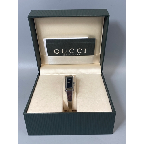 177 - Gucci 1500 L ladies watch with black face and stainless steel band with original box and papers