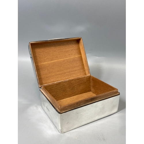 110 - Silver cased wooden box hallmarked Birmingham with unknown date, weight 290 grams