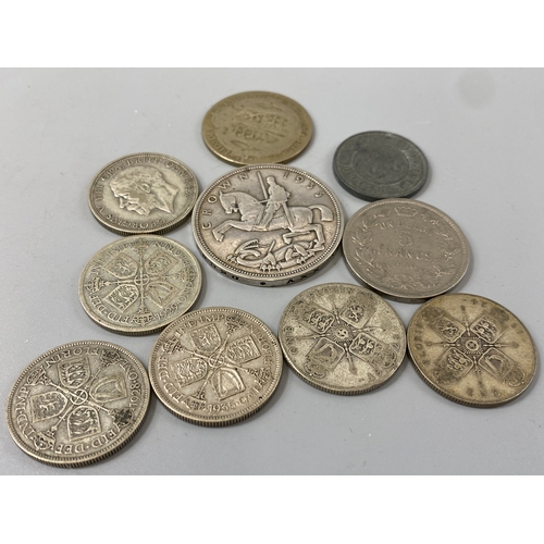 180 - Assorted lot of silver coins 128.76 grams in total to include 1935 crown, 6 one florin