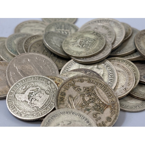 184 - Assorted silver coins to include mixture of shillings and six pence total weight 128.09 grams