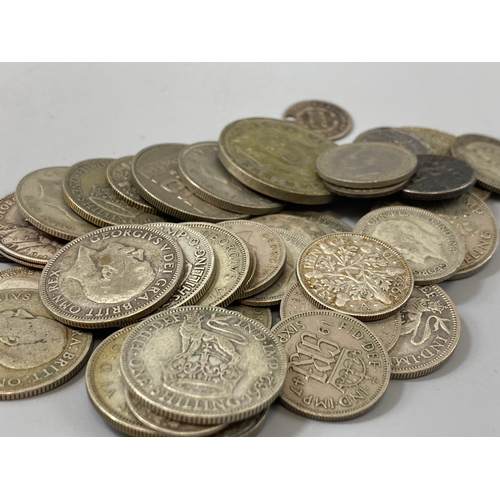 185 - Assorted lot of coins to include silver shillings and six pence total weight 166.85 grams