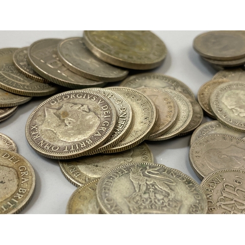 185 - Assorted lot of coins to include silver shillings and six pence total weight 166.85 grams