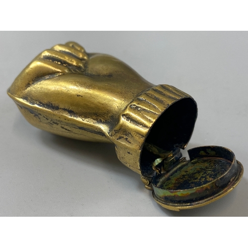 186 - A brass vesta case in the form of a fist