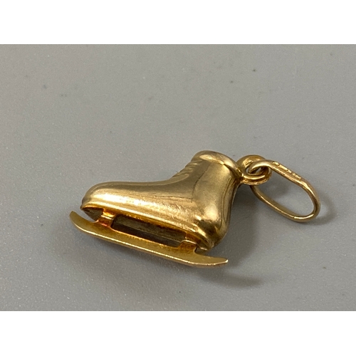 65 - 9ct gold ice skating shoe pendant/charm, weight 1 gram