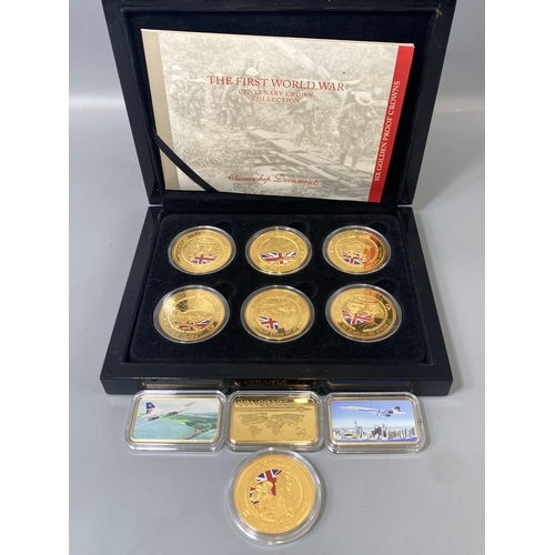 86 - Lot containing gold plated coins and medallions to include The First World War collection and 3 Conc... 