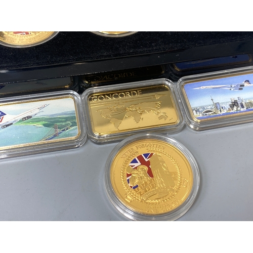 86 - Lot containing gold plated coins and medallions to include The First World War collection and 3 Conc... 