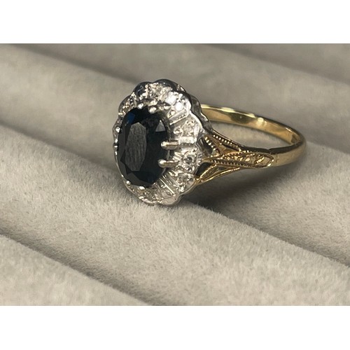 53 - 9ct Yellow Gold fully Hallmarked Cluster Style Ring featuring a Sapphire Centre Stone Weighing 2.64 ... 